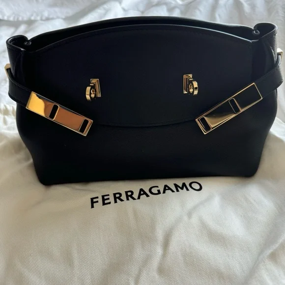 Ferragamo Hug Pouch bag in black and gold hardware - Picture 7 of 11